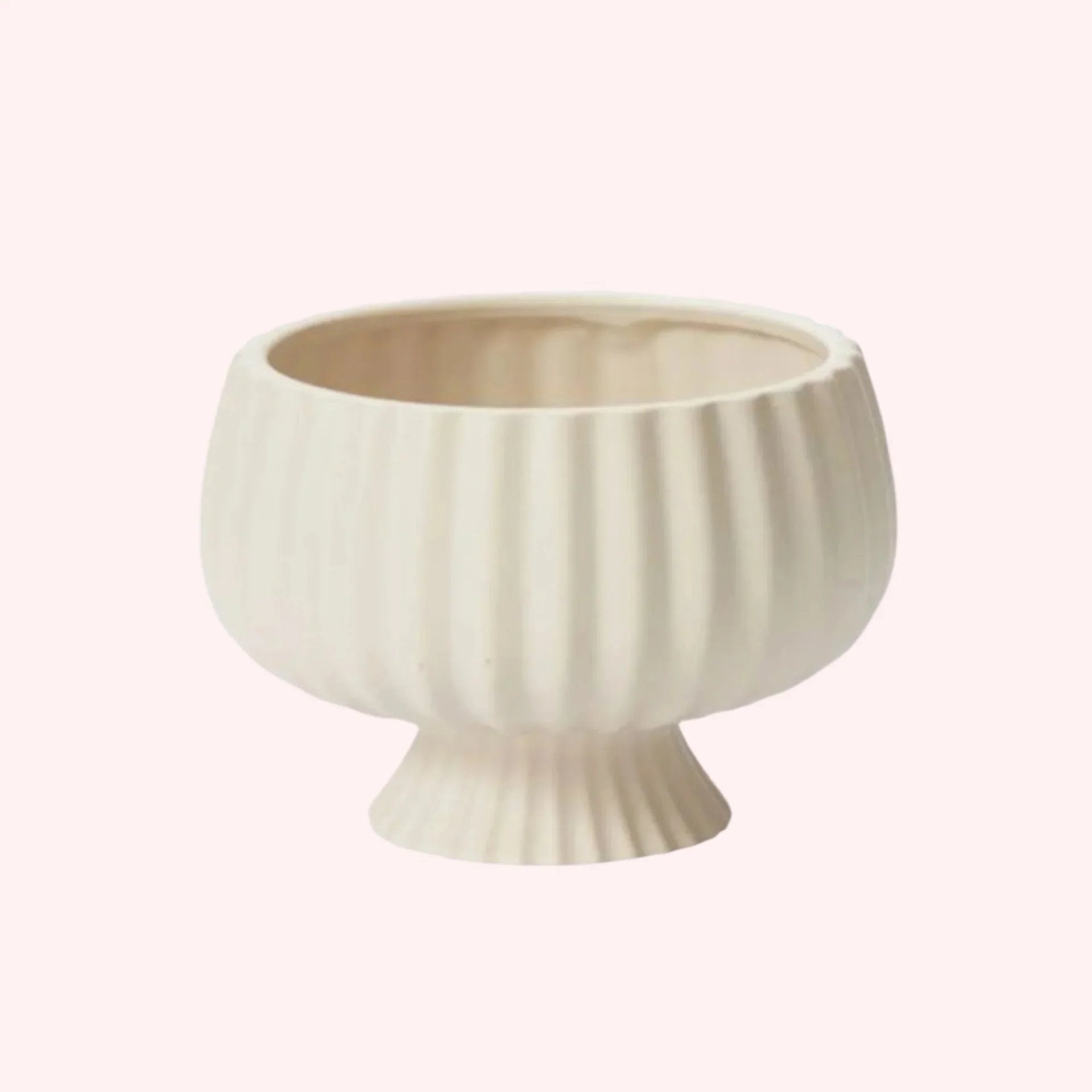 White ceramic bowl with ribbed texture on a white background