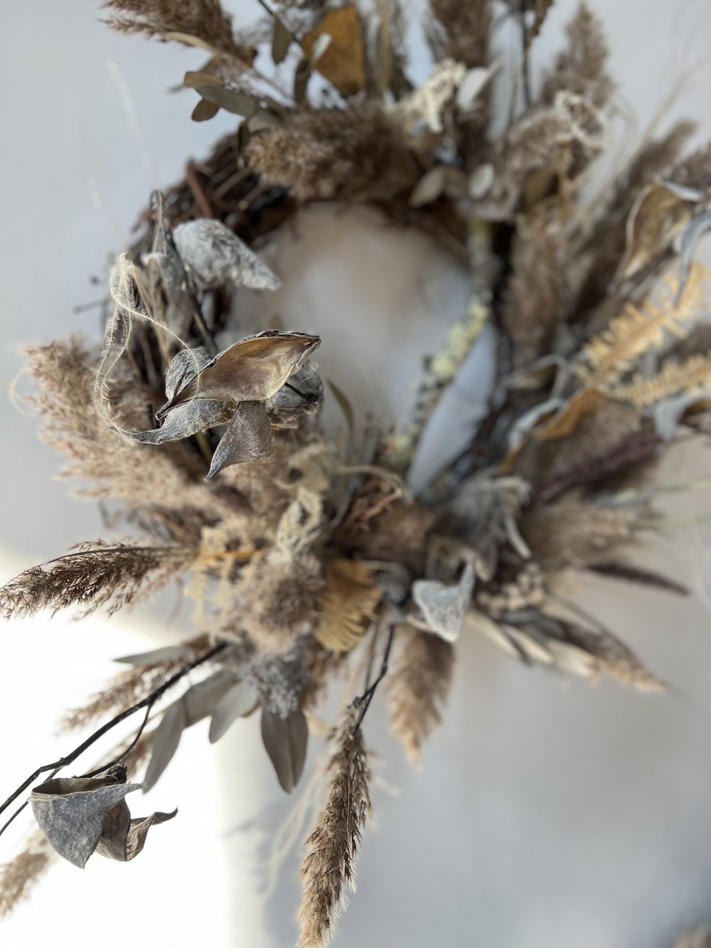 Dried floral arrangement on a white background