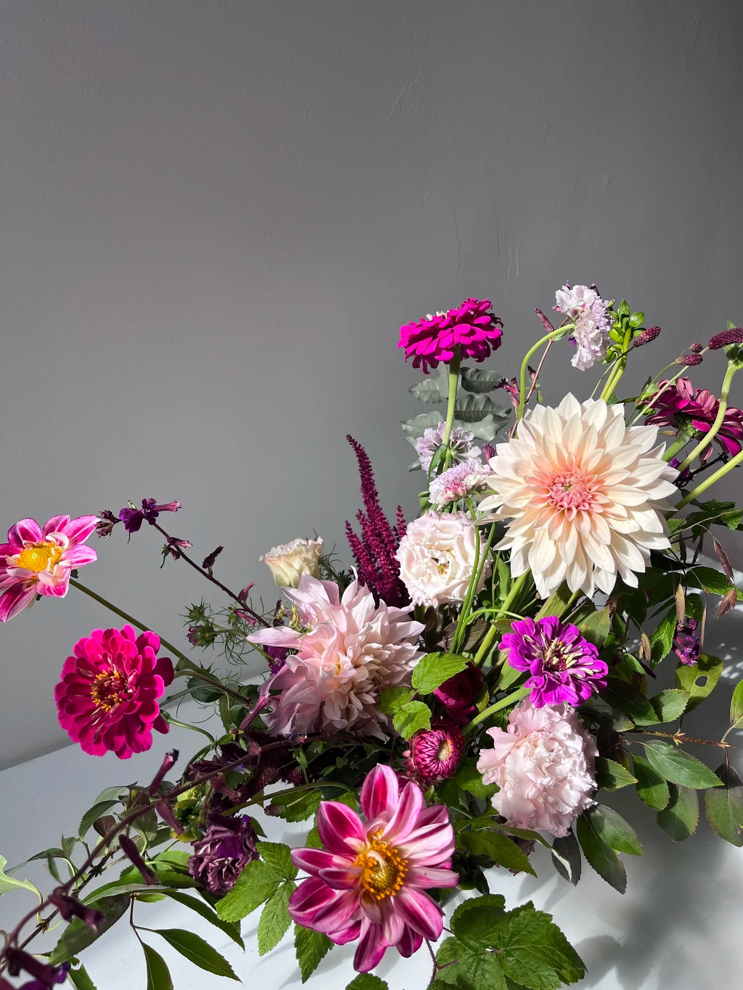 Bouquet of colorful flowers on a gray background