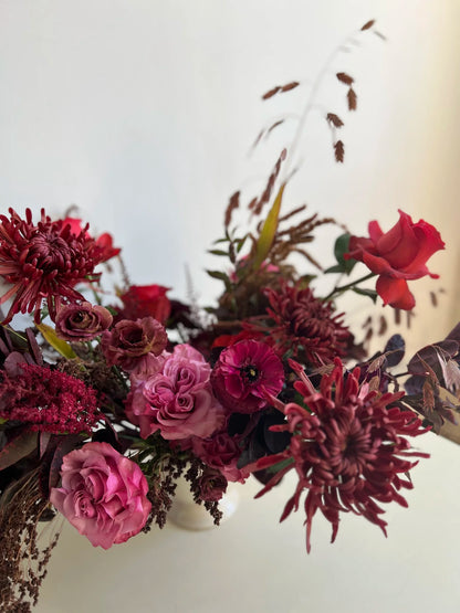 Bouquet of red and pink flowers with a white background