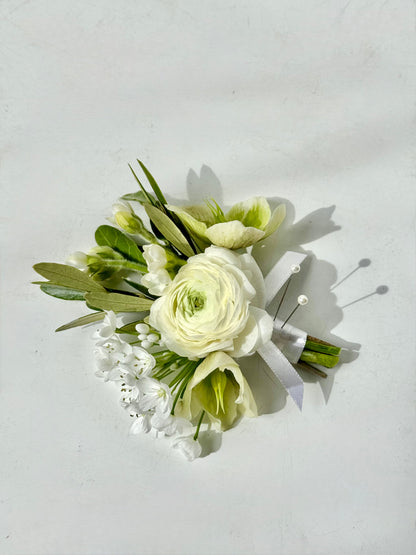 Floral corsage with white and green flowers 