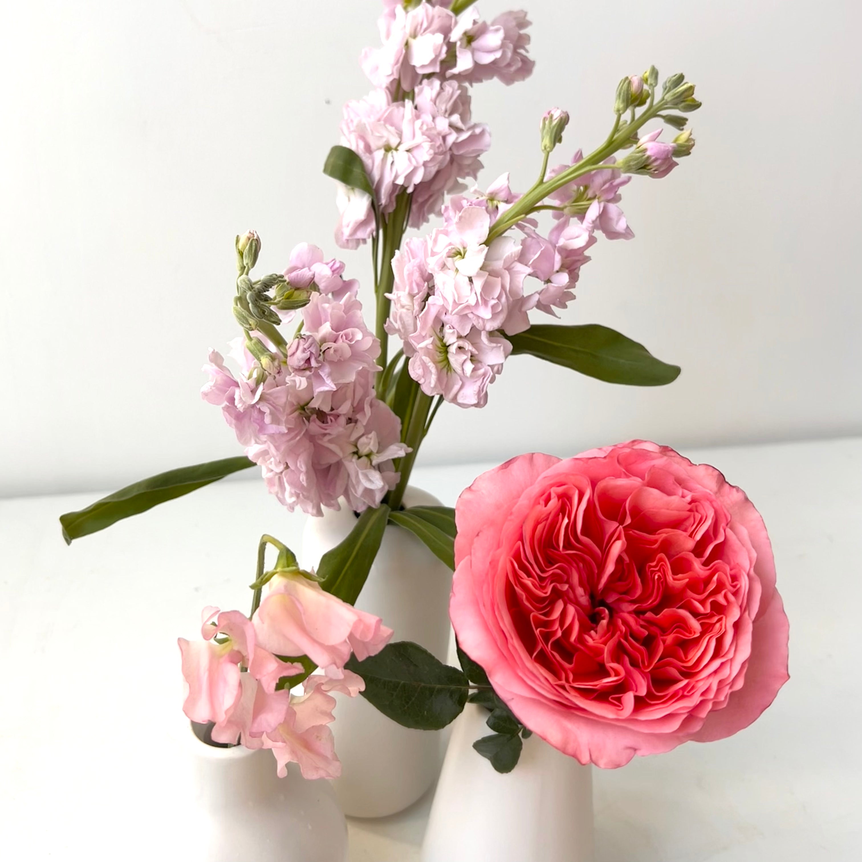Pink flowers in a bud vase for velentine's day delivery in portland maine