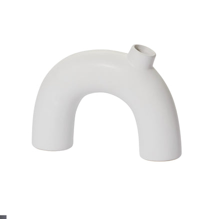 White ceramic vase with a modern, curved design on a white background