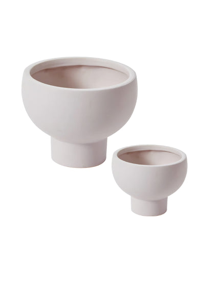 Two ceramic planters of different sizes on a white background