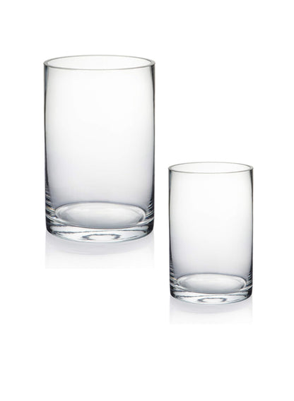 Two clear glass tumblers on a white background